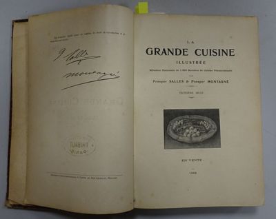 an open book with a picture of a plate of food on it