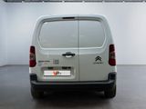 a white van that is parked in a room