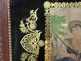 a picture of a woman with a sword in a picture frame