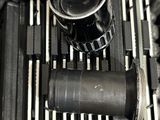 a close up view of a camera and a lens in a case