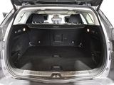 the back of a car with its trunk open and the back seats down