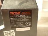 a close up of a parking meter with a qr code on it