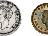 deux types différents de pièces d'argent, l'une à l'effigie d'une femme et l'autre à l'effigie d'un homme