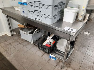 a large stainless steel table with a bunch of containers on it