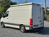 a white van that is parked in a parking lot