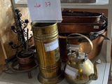 a shelf that has a lot of antique items on it