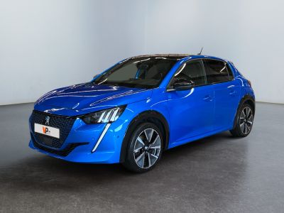 a blue car in a white room with a black floor