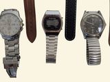 many different types of watches displayed on a white background