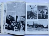 an open book with pictures of military men and planes