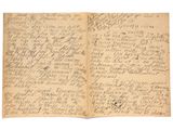 un vieux livre écrit posé sur une table