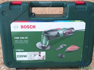 the box is open on the floor with the tools in it
