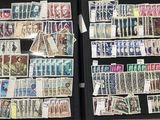 many different types of stamps on display in a case