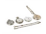 four different types of pocket watches on a white surface