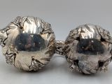 pair of antique silver plated fish salt and pepper shakers