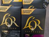 four boxes of lor espresso coffee sitting on a table