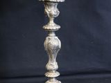 silver plated candelabra with birds and flowers on it