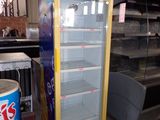 a display case that has drinks in it in a warehouse