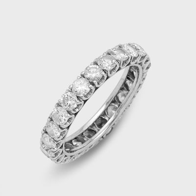 a close up of a diamond ring on a white background