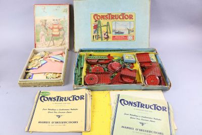 a box of construction books and a box of construction kits