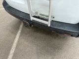 a picture of a white truck parked in a parking lot