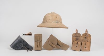 an image of a group of items including a hat, boots, and other items