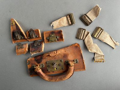 five pieces of luggage sitting on a table next to a pair of scissors