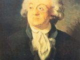 portrait of a man with white hair wearing a black coat and a white tie