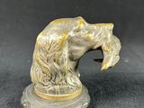 pair of antique brass lions head figurines on stand