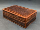 a wooden box sitting on top of a gray surface