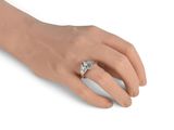 an image of a woman ' s hand with a diamond ring on it ' s finger