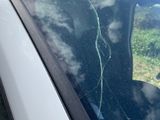a car that has a broken windshield and a broken window