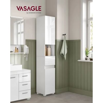 a picture of a bathroom with green walls and a white cabinet