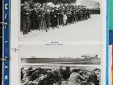 an old black and white photo of a group of men standing in front of a line of soldiers
