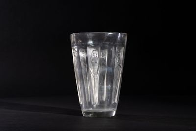 the glass is empty on the table on a black background