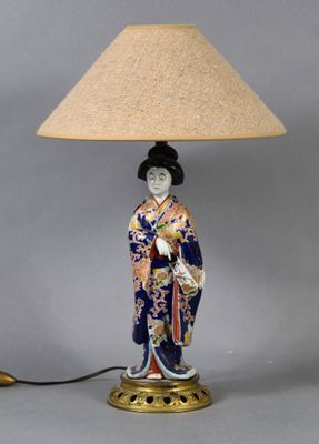 an image of a lamp with a woman in a kimono outfit on it