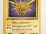 a close up of a pokemon card on a white surface