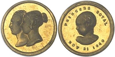 two pieces of gold coin with a woman ' s profile and a man ' s profile