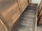 a wooden bench that has been built into the wall