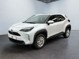 a white toyota c - hr suv parked in a garage