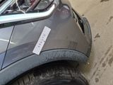 a close up of a car with a sticker on it ' s bumper