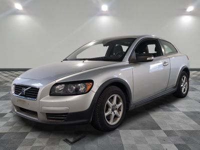 a picture of a silver volvo vehicle in a room
