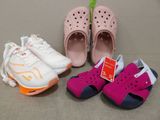 three pairs of children ' s shoes are lined up next to each other
