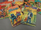 a lot of comic books that are on the table