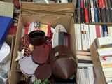 a box full of books and other items on the floor