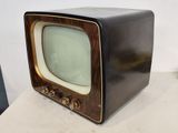 an old television sitting on top of a table