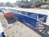 an image of a large blue metal structure in a parking lot