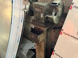 a machine that is sitting next to a pile of boxes