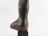 bronze sculpture of a female torso on a black base
