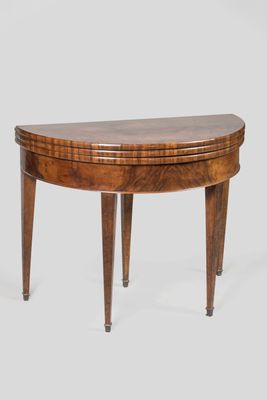 a wooden table with a curved top and legs