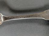 silverware spoon with the name of a person engraved on it